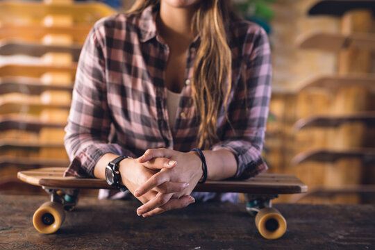 Image of midsection of caucasian woman posing in skate shop