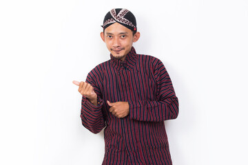 asian man with javanese traditional cloth lurik welcoming guests gretting isolated on white background
