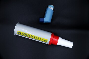 A peak flow meter with an inhaler medicine. A peak flow test is used in the treatment of asthma to...