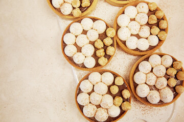 Group of french hazelnut creamy tart. Aesthetic breakfast. Copy space