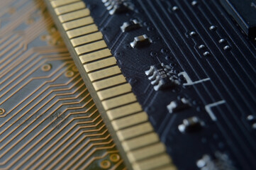 the RAM module from the computer lies on top of the motherboard. close-up
