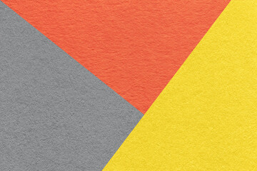 Texture of craft gray, yellow and orange shade color paper background. Structure of vintage abstract cardboard