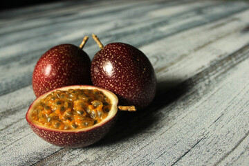 red passion fruit on white wooden backdrop