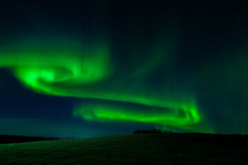 Northern lights over the hill