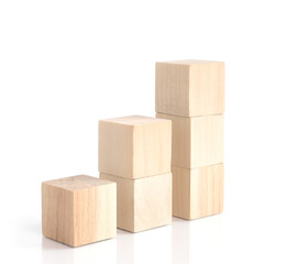 Business concept growth success process, statistics graph. Wooden blocks stacking as an arrow up averages as a growth graph chart on white background.