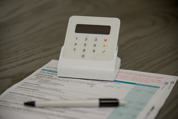 view of an invoice placed on a desk with a payment terminal