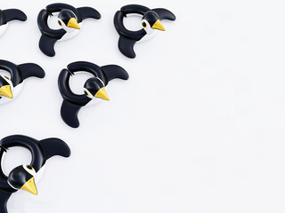 Inflatable penguins on white background in summer season. 3D rendering, 3D illustration
