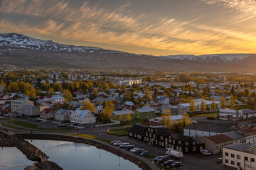Beautiful view of Akureyri’s Old Town at Sunset from a high point in a summer day.