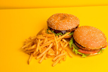 Burger with chicken and vegetables, burger with chicken on a yellow background