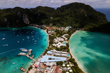Aerial photo of Koh phi phi island in thailand with turquoise sea along with village and harbor