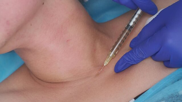 Closeup of cosmetic botox injection in the neck