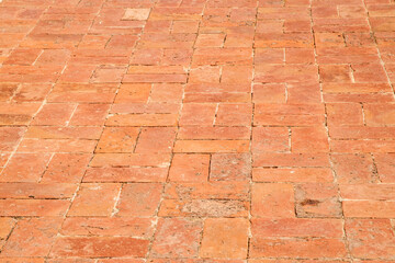 Red clay brick floor surface closeup as background