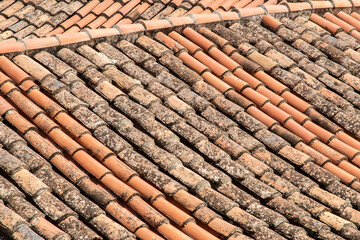 Roof of old houses covered with clay tiles