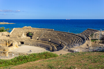 The steps of the ancient Roman Amphitheater in Tarragona, next to the Mediterranean Sea.