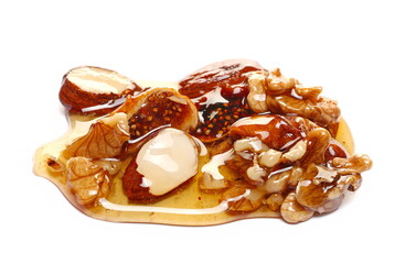 Honey and nuts on isolated on white, (almond, fig, walnut)