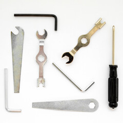 set of locksmith tools hex wrenches and screwdrivers close-up on a white background