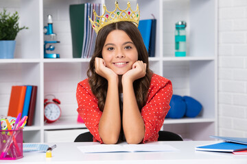 Princess school girl. Teenage selfish girl celebrates success victory. Teen child in queen crown. Princess in tiara. Prom party. Happy girl face, positive and smiling emotions.