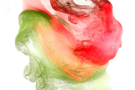 Green red smoke abstract background, acrylic paint underwater explosion