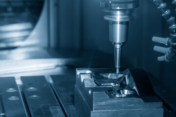 The CNC milling machine cutting press die by solid ball end mill tool.