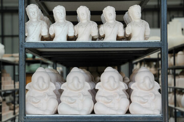 The clay pottery ceramic products dry on shelf in pottery factory.