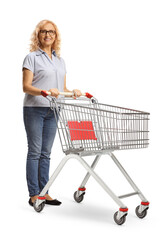 Mature woman standing with an empty shopping cart