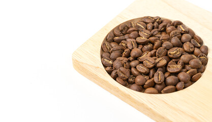Coffee beans on a wooden tray isolate on white background. Selective Focus. Close Up.