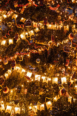 Obraz premium Christmas tree with lights of garland for the new year