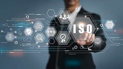 Business hand clicks ISO certification process and quality management for business and companies....
