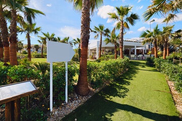 Palm lined entrance to the tropical restaurant. Spain