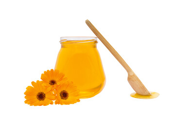 on a white background, a jar with honey is next to a wooden spoon with flowers