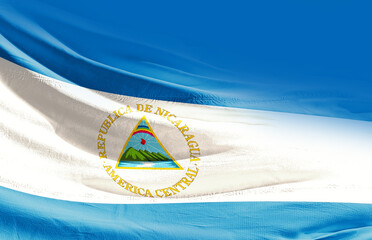 Nicaragua national flag cloth fabric waving on the sky - Image