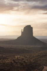 Fototapeta na wymiar Desert Rocky Mountain American Landscape. Morning Dramatic Sunrise Sky Art Render. Oljato-Monument Valley, Utah, United States. Nature Background