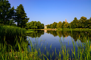Fototapeta na wymiar Scenic landscape panorama in “Gartenreich Dessau-Woerlitz“ Germany on sunny summer evening in warm sunlight is a public Unseco World Heritage site in Saxony-Anhalt Germany on the river Elbe.
