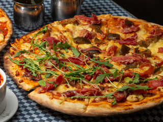 pizza with salami and arugula 