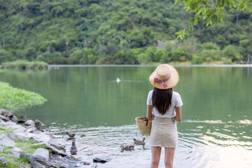 Woman look at the beautiful lake