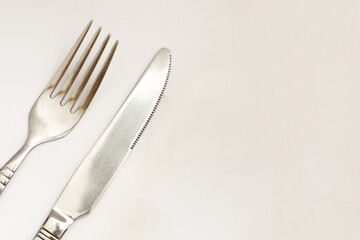 Knife and fork isolated on white background. Silverware, restaurant concept. 