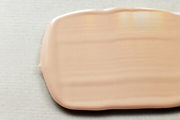 liquid tone foundation texture background. Makeup Concept
