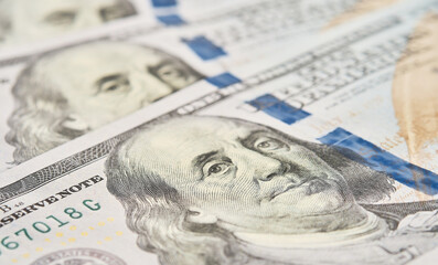 Currency close-up of one hundred US dollars banknotes. Portrait of the president, selective focus. Business finance concept, business news splash screen, banner mockup