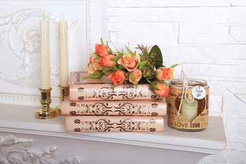 A book with flowers and candles