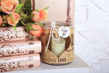 A book with flowers and candles