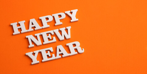 We wish a happy new year - White letters on wood
