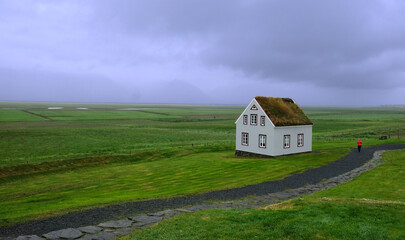 Lonely standing rural house in the boundless expanse of Iceland