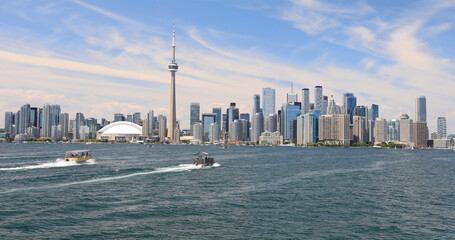 Toronto skyline and Ontario lake with boats on the foreground