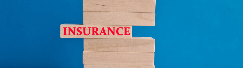Wooden blocks with text insurance safety protection and guarantee