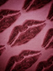 Groovy pattern of trace of a First Kiss on a pink background. A trace of lips with pink lipstick. Valentine concept. 