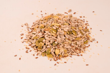Mix of seeds for a salad. A pile of mixed seeds isolated on white background.