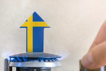 Gas price. Rise in gas prices in Sweden. A burner with a flame and an arrow up, painted in the...