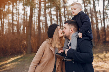 Cute family playing in a spring park