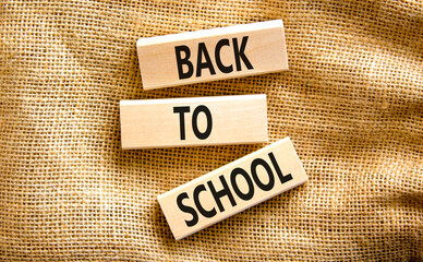 Back to school and support symbol. Concept words Back to school on wooden blocks on canvas. Beautiful canvas background. Business, educational Back to school concept. Copy space.