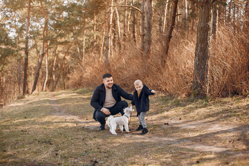 Fototapeta premium Cute family playing in a summer park